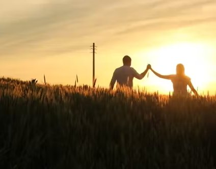 Mentor and Student walking towards sunset