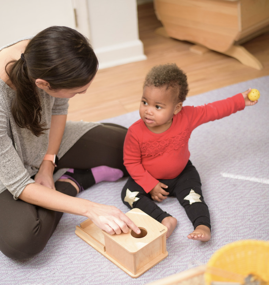 Montessori teacher with toddler