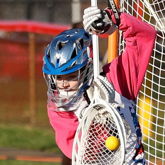 Youth lacrosse goalie diving save