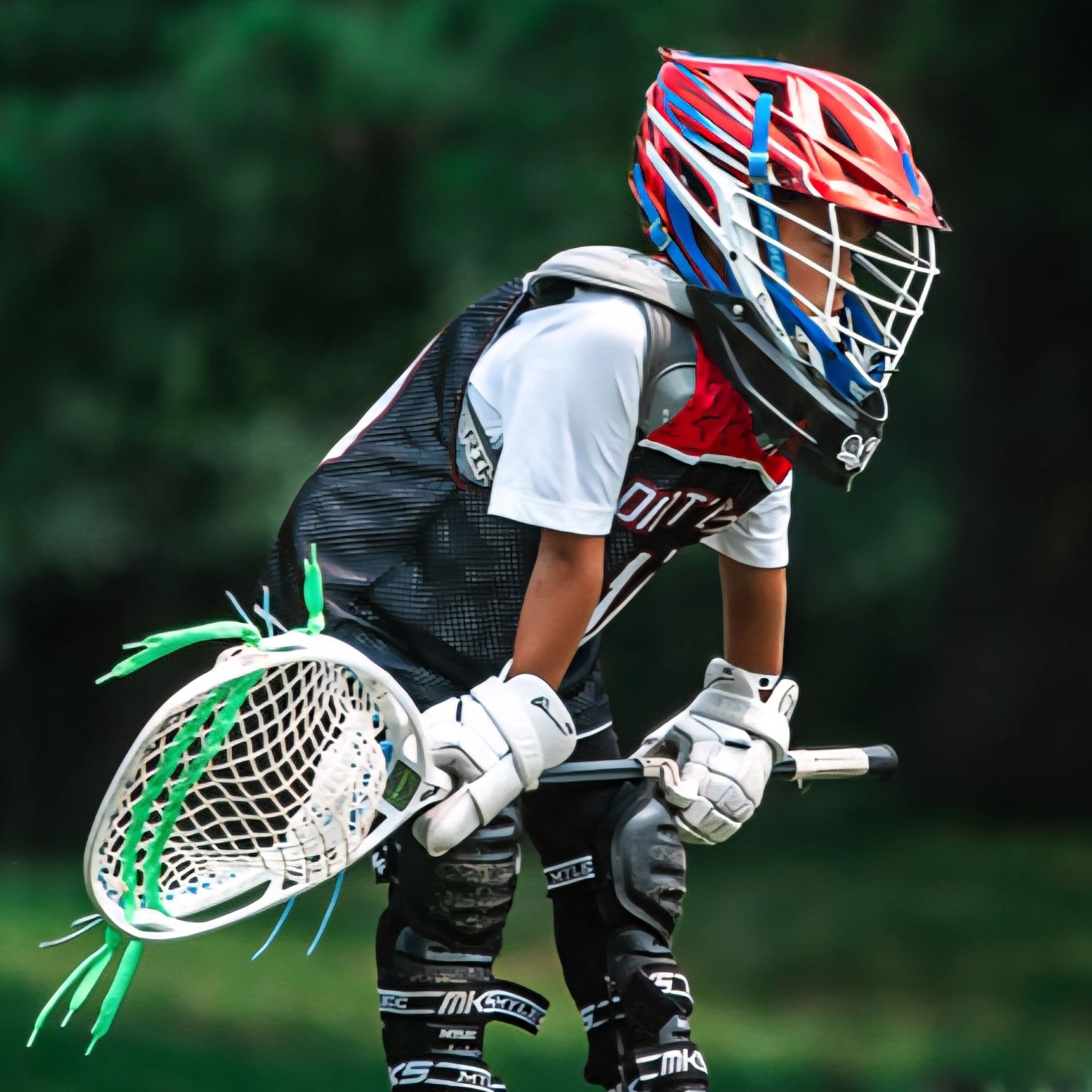 Youth lacrosse goalie clearing ball