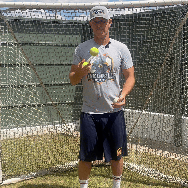 Coach Damon juggling tennis balls on the lacrosse field