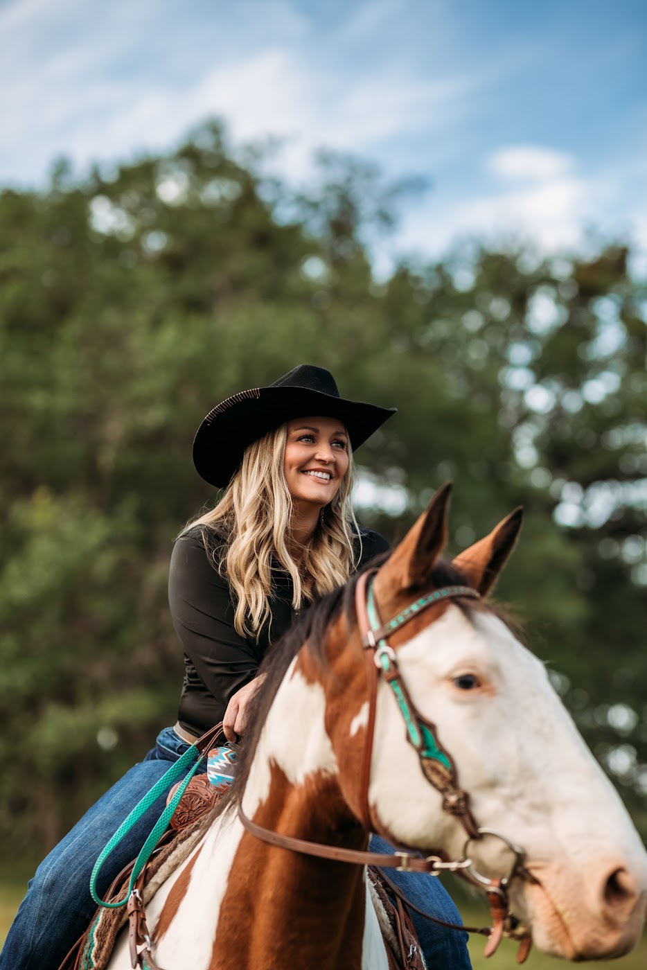 Sausha Davis riding her paint horse