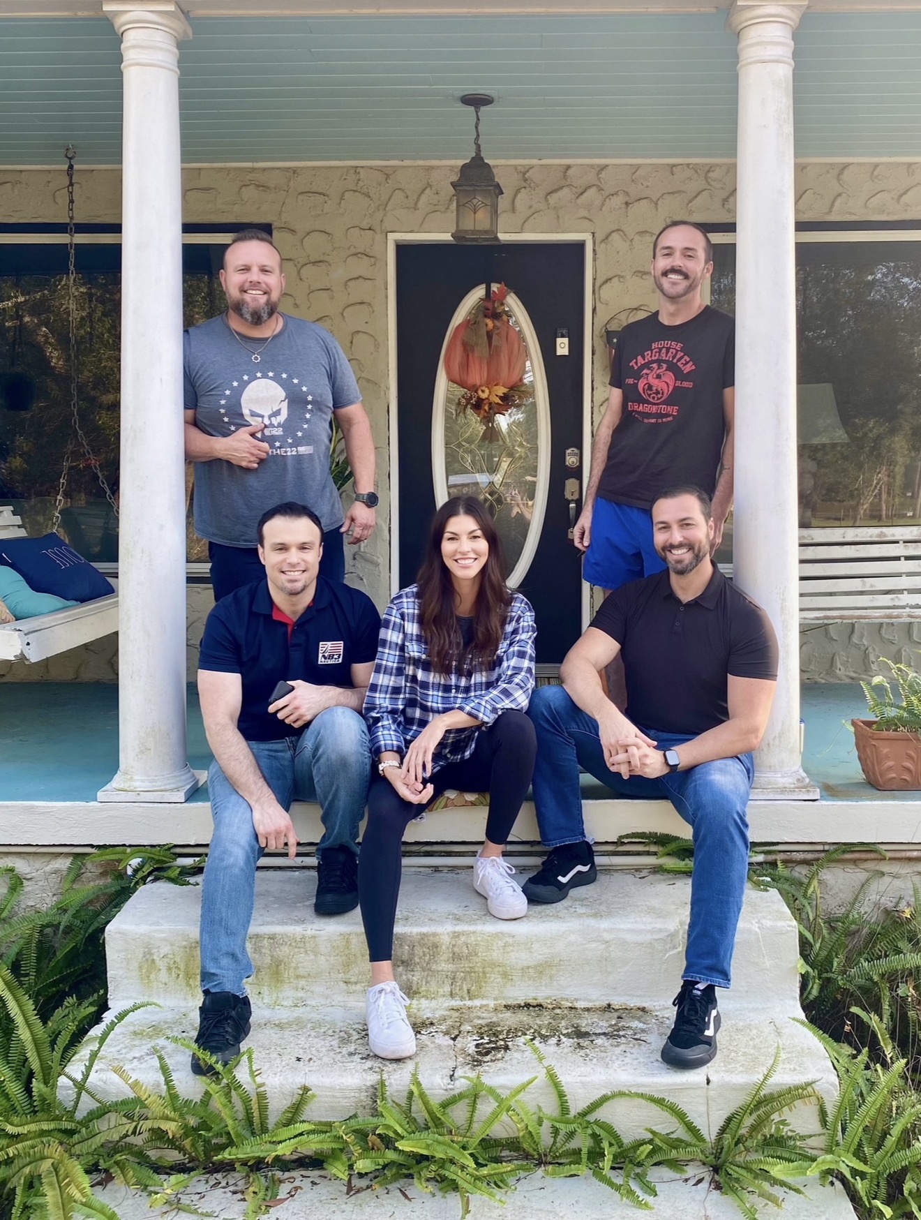 Heather with her four brothers on a front porch