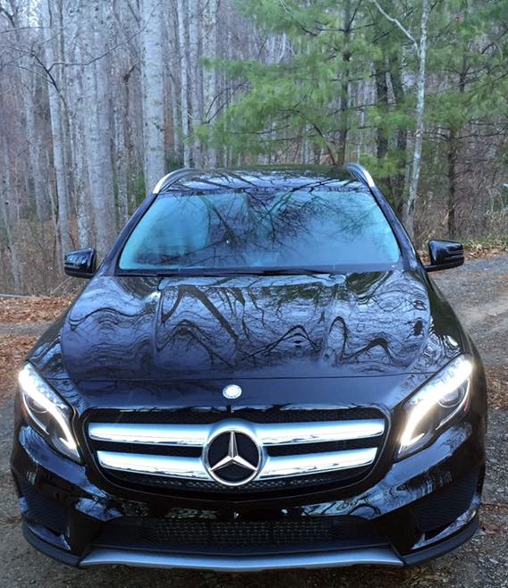 Picture of Mercedes SUV, from the front, in the woods