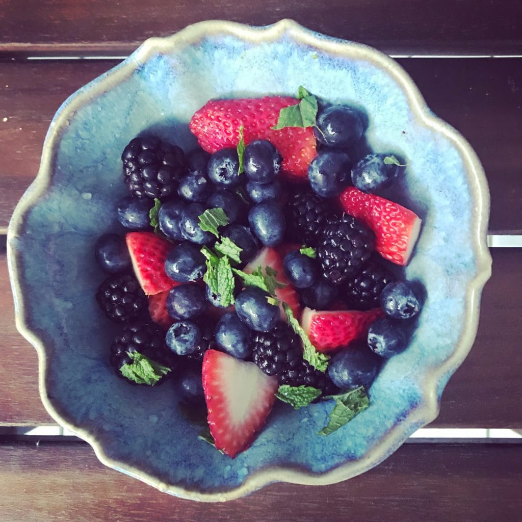 bowl of berries with mint