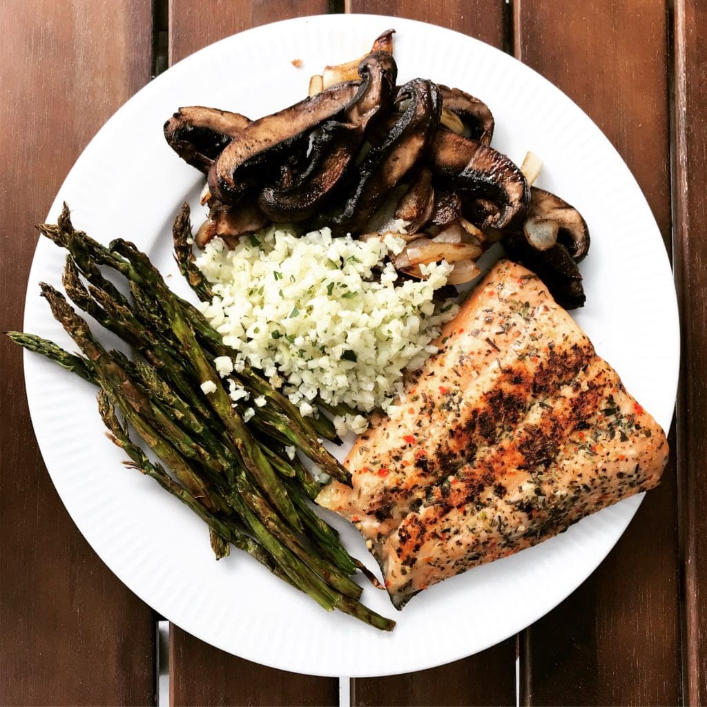 salmon, roasted asparagus, caramelized onions and mushrooms, and cauliflower rice