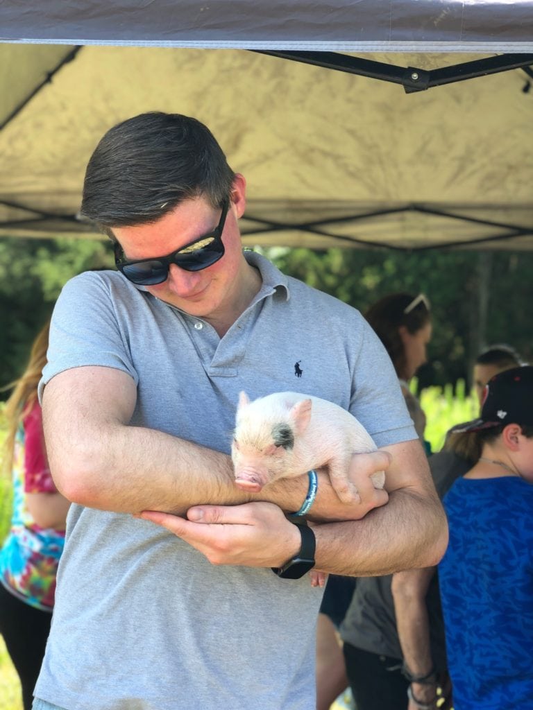 Matt with baby pig