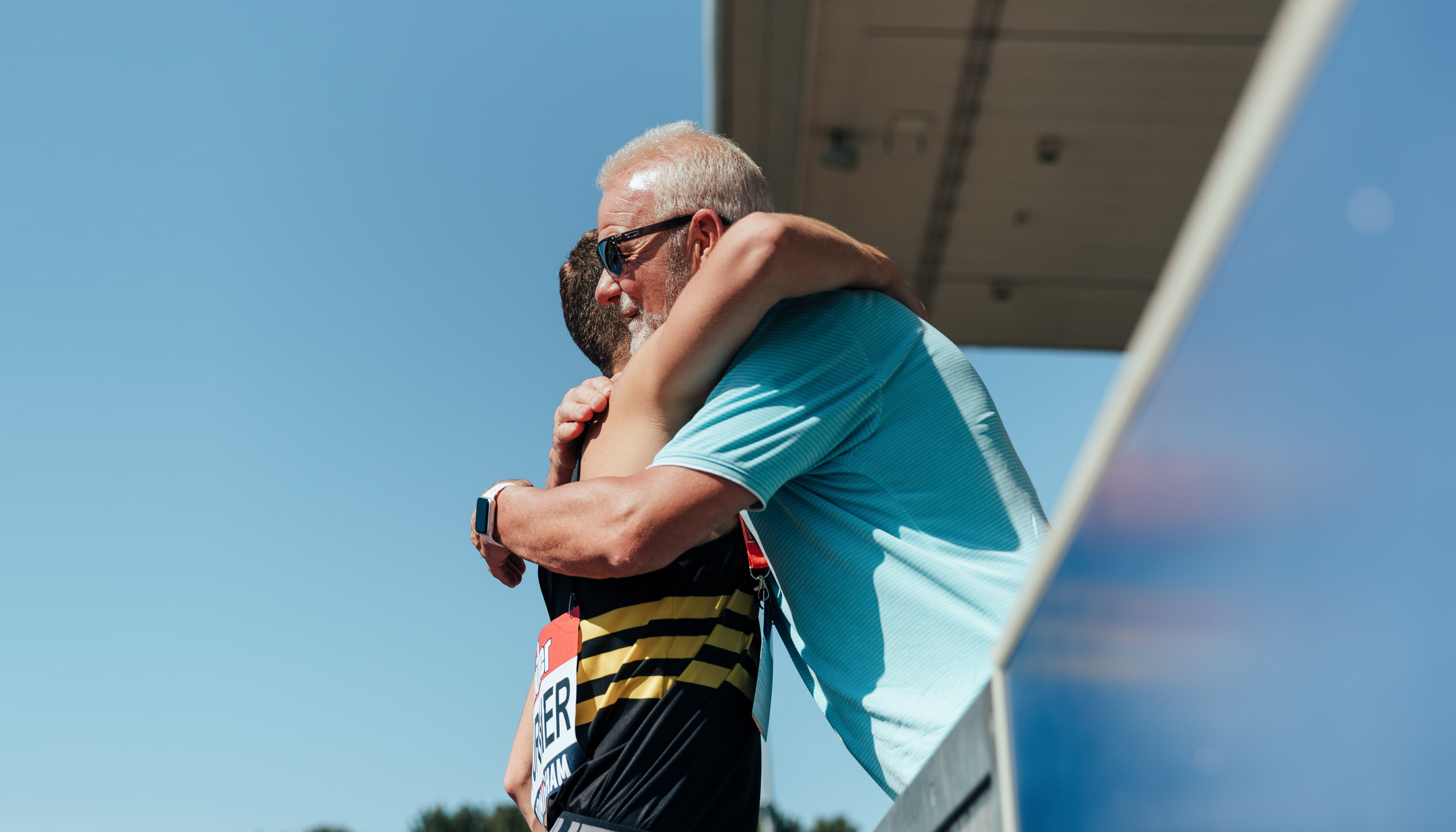 A parent supporting a young athlete