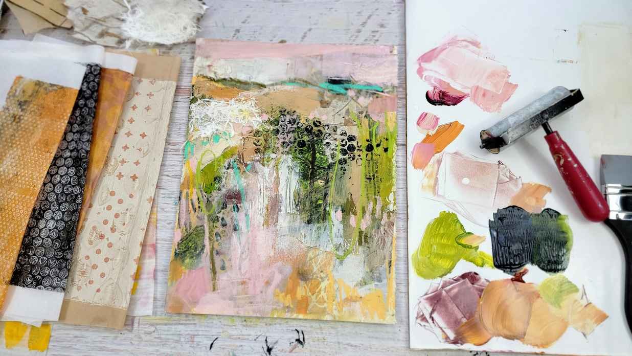 Brayer, paint palette, painting on paper, scraps of paper