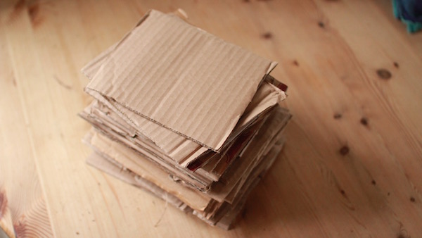 If you cut your cardboard up into squares, you can sandwich the spawn between each layer after pasteurisation. 