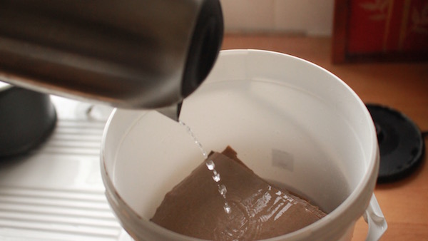 Soaking the cardboard in boiling water is vital to kill off contaminating organisms. Make sure the water is completely cool before adding the mushroom spawn. 