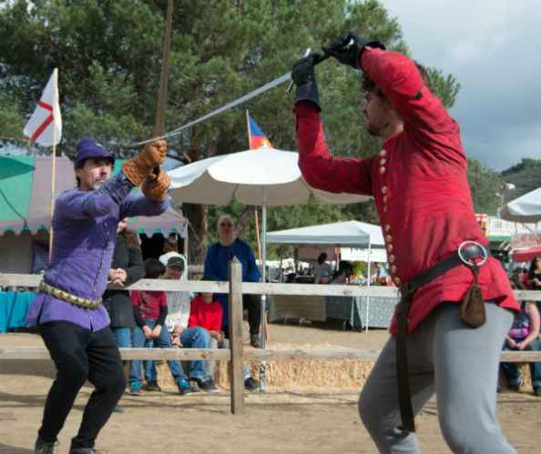 Program coaches Scott Farrell (left) and Kyle Lazzarevich demonstrate the medieval art of fencing with the German longsword at the 2015 Tournament of the Phoenix in Poway, CA